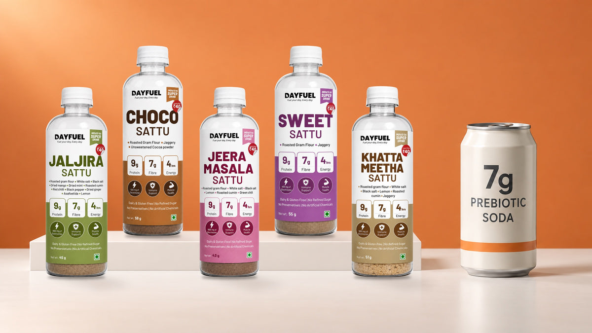 The five Dayfuel sattu bottles, each showing 7 g of fibre, beside a prebiotic soda can labelled 7g
